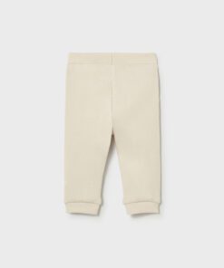 Cream colored baby jogger pants with ribbed waistband and cuffs front view