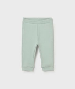 Mint green knit baby pants with ribbed cuffs and elastic waistband for infants or toddlers