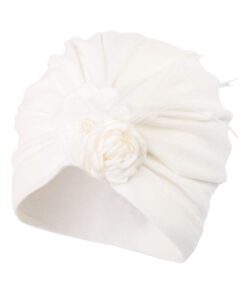 White knit beanie with a fabric flower embellishment on the side, for a cozy winter look, no visible text.