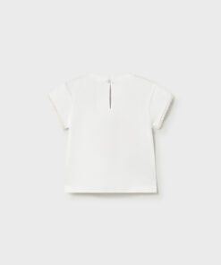 White short sleeve blouse with lace trimmed edges and a small back keyhole opening viewed from the back