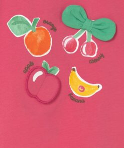 Pink fabric featuring embroidered fruit patches orange cherries with a green bow an apple and a banana