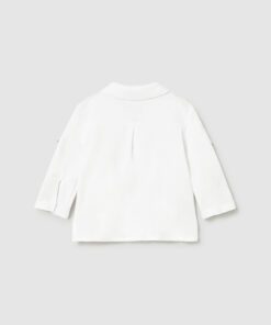 Back view of a plain white long sleeve shirt on a light gray background