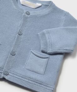 Light blue knitted cardigan for a child with button front and a small pocket