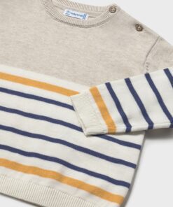 Beige knit sweater for kids with navy and mustard stripes ribbed cuffs and hem shoulder buttons on the shoulder
