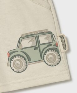 Beige backpack with a green illustrated off road jeep patch near the corner
