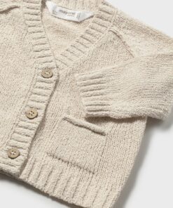 Cream knitted cardigan with wooden buttons ribbed cuffs and a small front pocket child sized