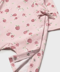 Pink baby romper with peach pattern, featuring a side bow and snap closures at the leg.