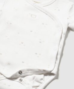 White baby bodysuit with a tiny scattered dot pattern and side-left snap closures along the chest and bottom.