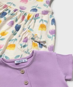 Light cream dress with pastel tulip print and gathered waist paired with a lavender knit cardigan for a child