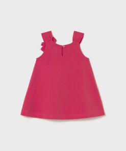 Pink sleeveless toddler dress with ruffled straps and a small back button centerpiece at the neckline