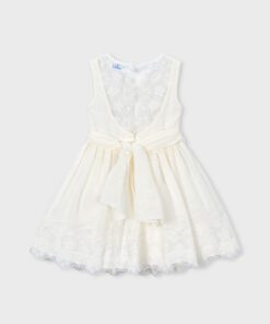 Ivory lace dress for a child with a waist sash tied in a bow and scalloped lace hem special occasion dress