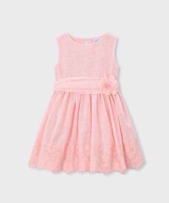 Pink sleeveless girls dress with a textured bodice waist sash fabric flower and a lace trimmed skirt hem for a dressy look