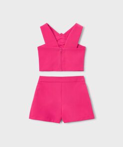 Bright pink two piece swimsuit cropped top with wide shoulder straps and back zipper plus matching high waisted shorts