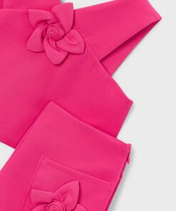 Bright pink dress featuring fabric flower bows and a front pocket detail cropped view