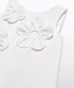 White sleeveless dress with large fabric flowers along the necklinebodice