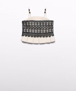 Beige pleated choker with a wide black lace band worn around the neck as an accessory