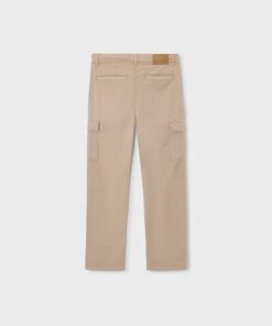 Back view of beige cargo pants with rear welt pockets belt loops and thigh cargo pockets